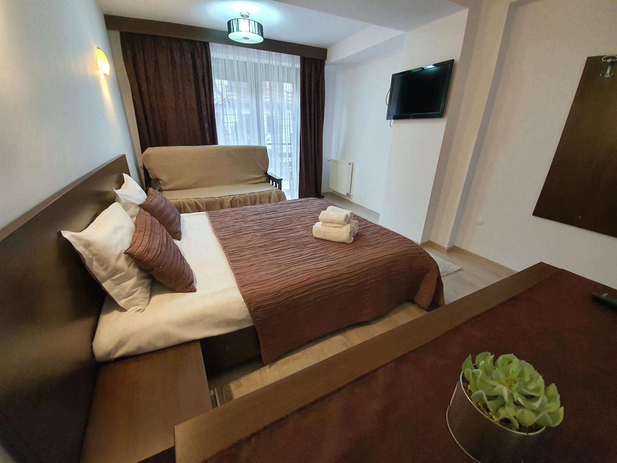 Pensiunea Public House Буштени Номер фото